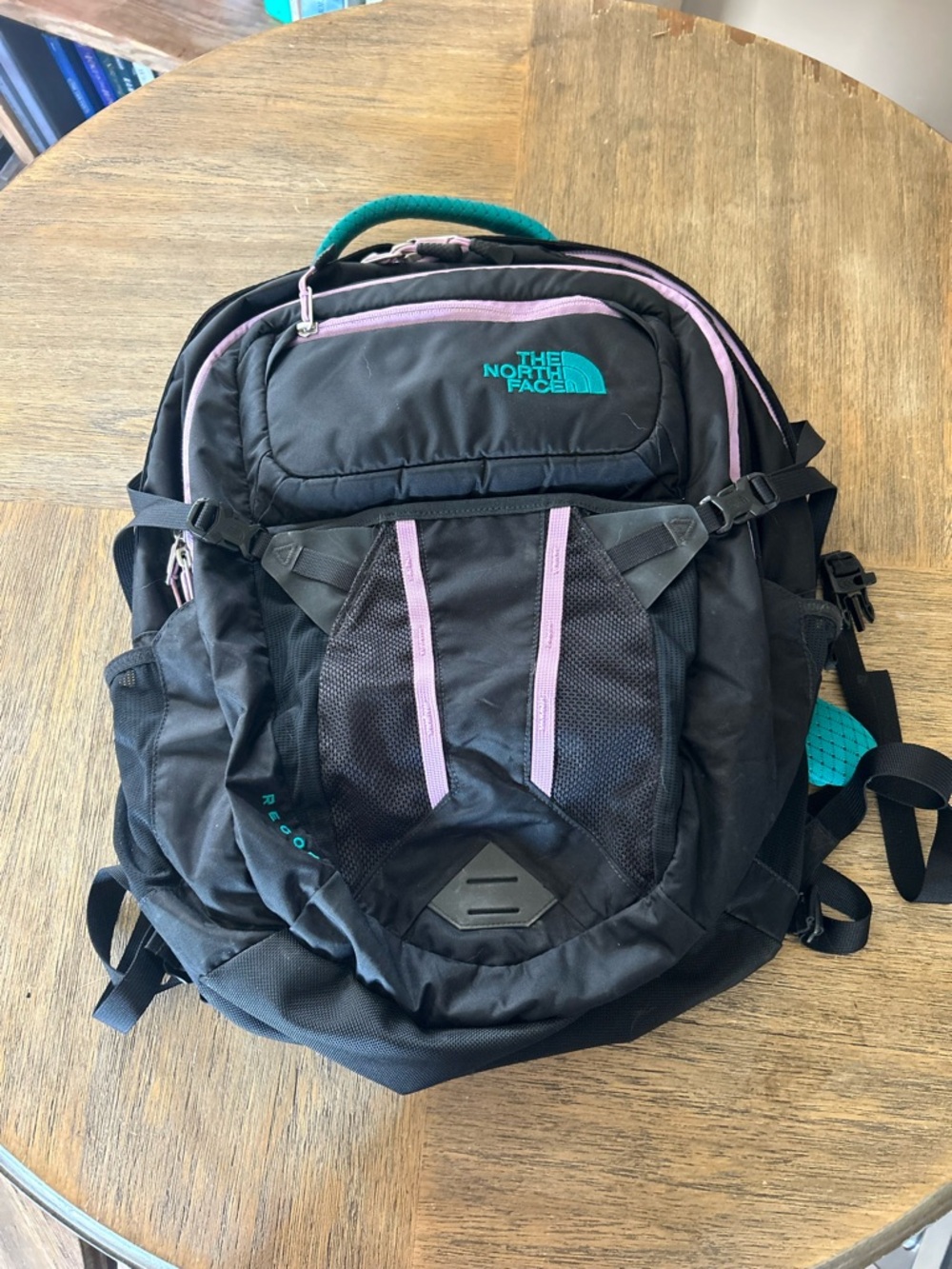 The North Face Black Backpack with Teal Mesh Padding and Pink Trim‎